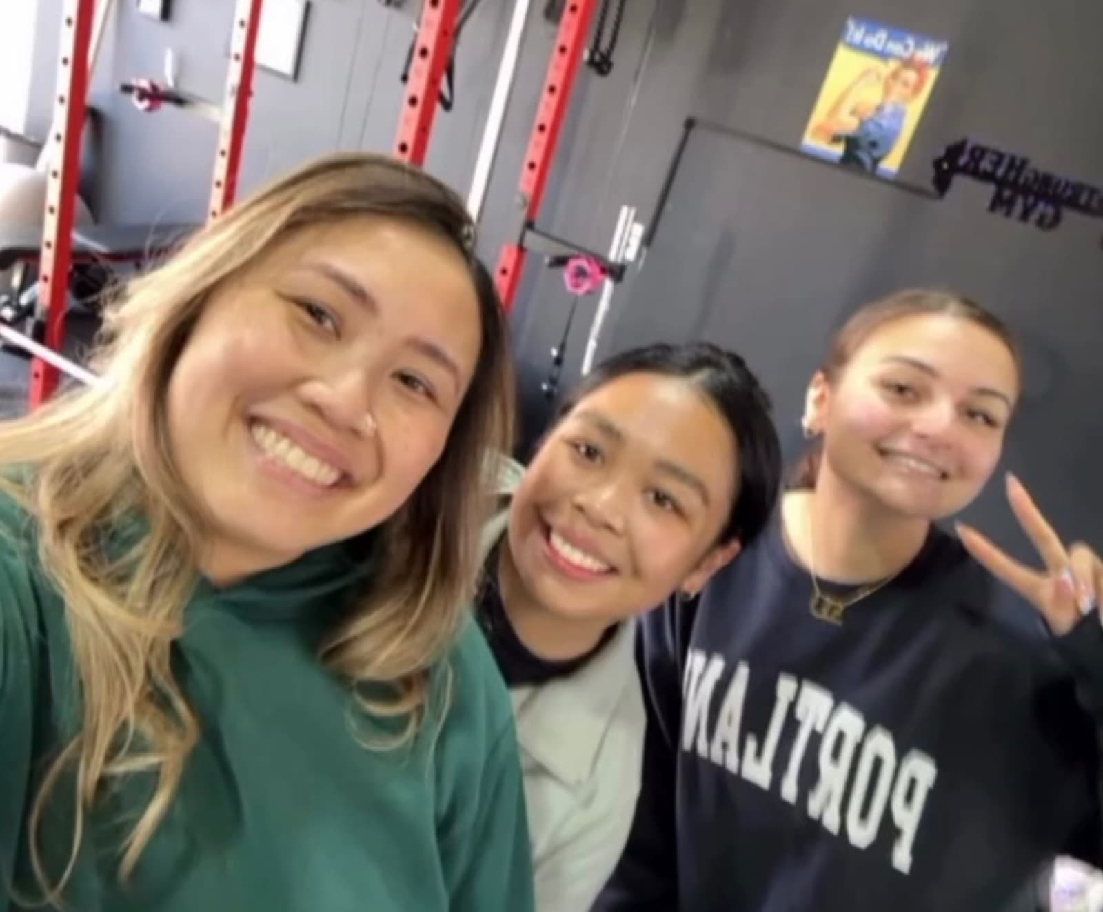 Three StrongHER gym members smiling together after training