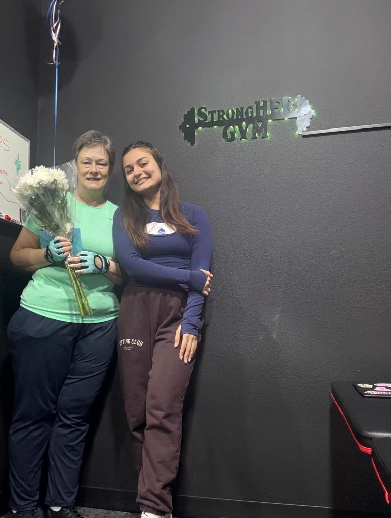 Celebration at StrongHER Gym with Rand and a client
